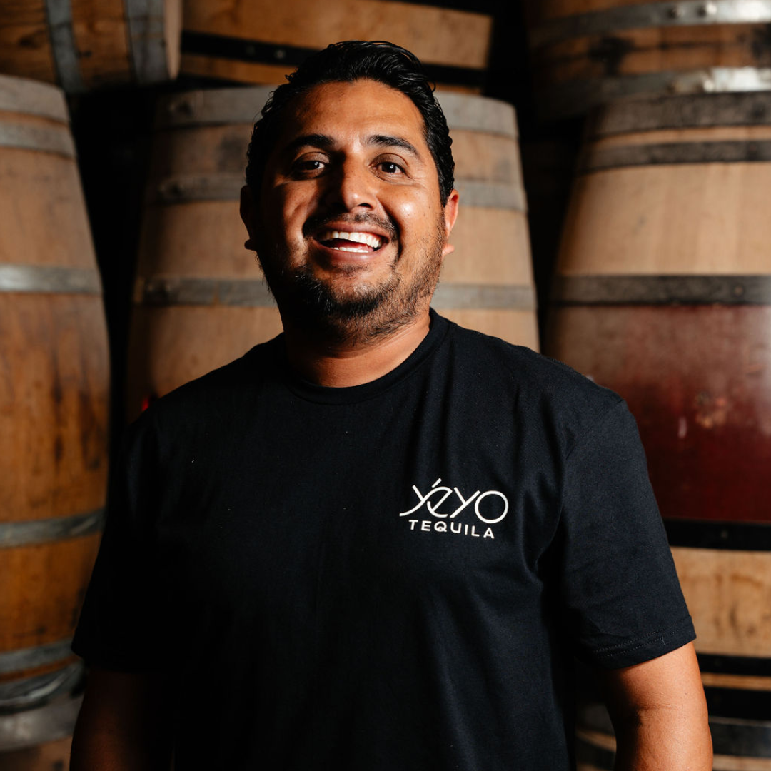 Yéyo Master Distiller Sergio Cruz among aging barrels